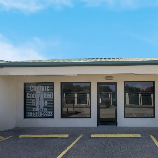 Exterior of the main entrance with keypad access at StorQuest Self Storage in Richmond, Texas