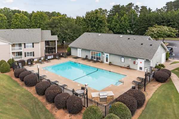 Swimming pool with lounge beds at The Victor in Greenville, South Carolina