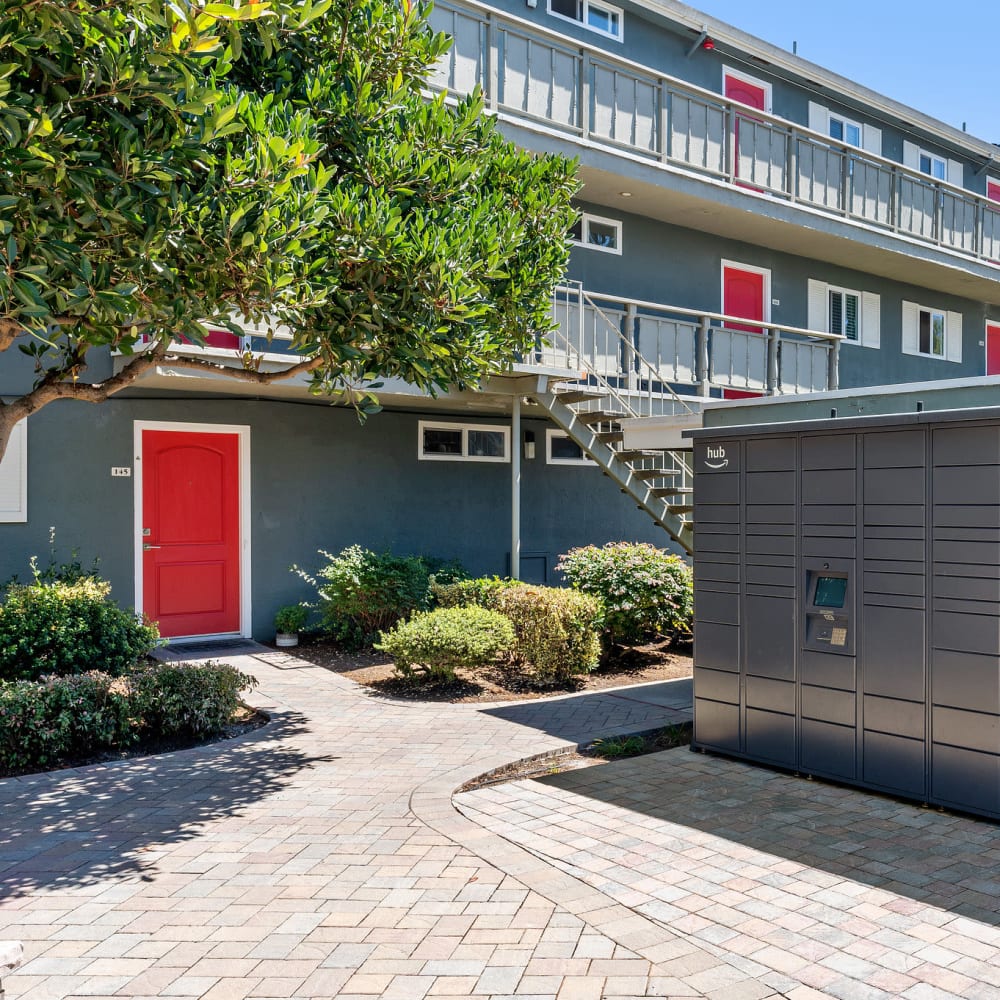 Courtyard and Amazon Hub package locker at Pinebrook Apartments in Fremont, California