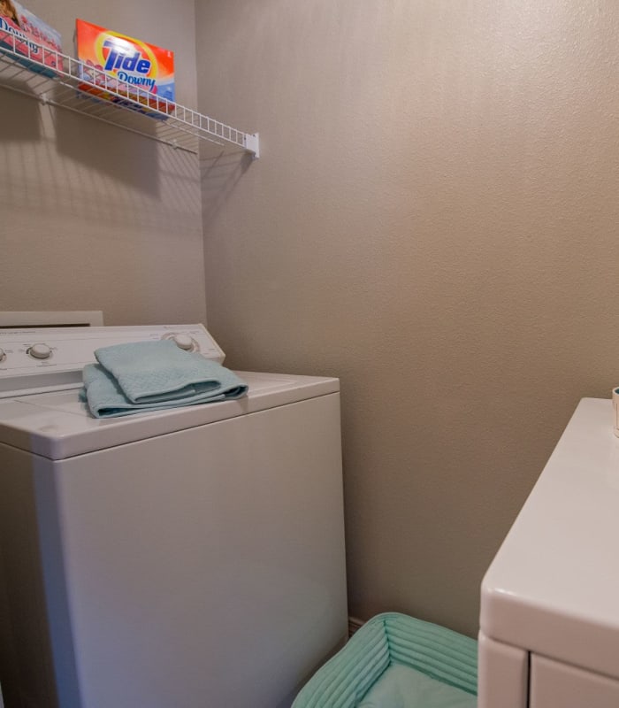 Washer and dryer setup at Crown Chase Apartments in Wichita, Kansas