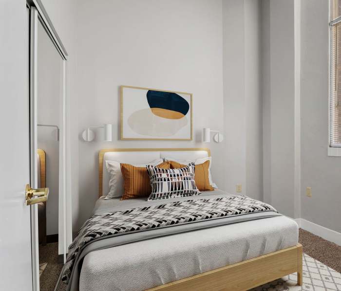 Bedroom with a large bed at Wilson School Apartments in Muncie, Indiana