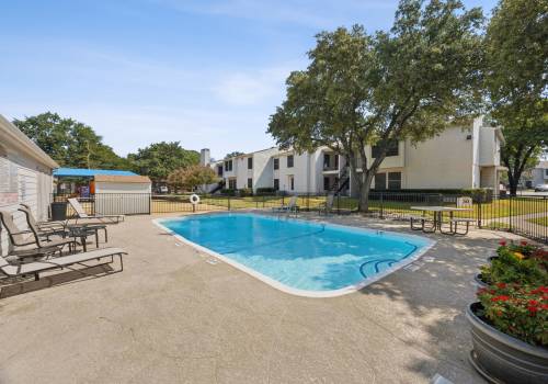 Charming pool with lounge beds at Sleepy Hollow in Arlington, Texas
