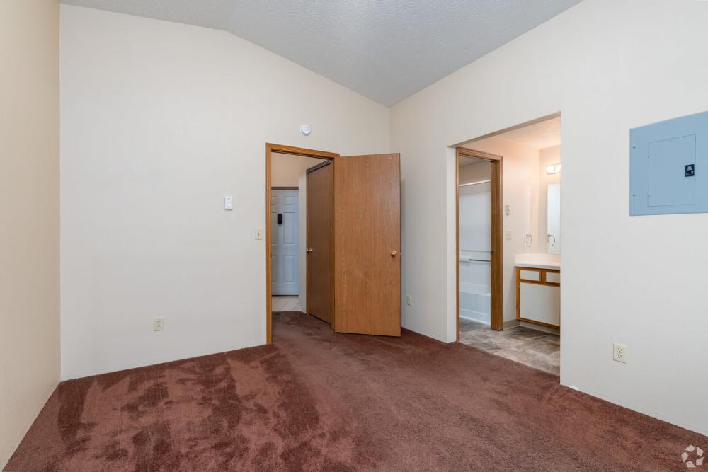 Unfurnished bedroom with access to bathroom and living at Stonecrest Apartments in Spokane, Washington
