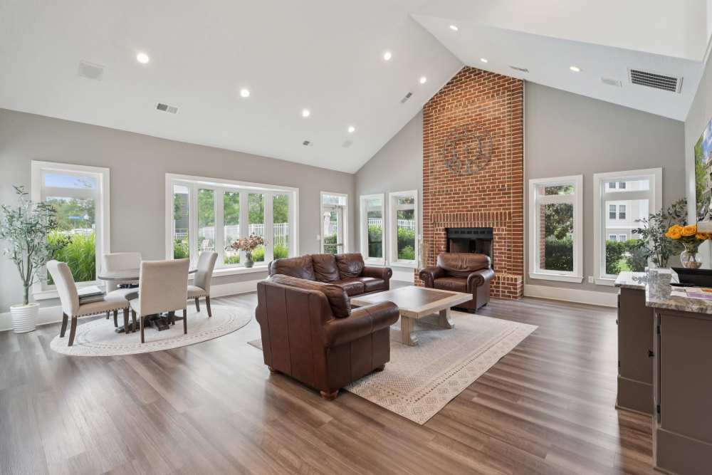 Community lounge area with fireplace at Dulles Center Apartments in Herndon, Virginia