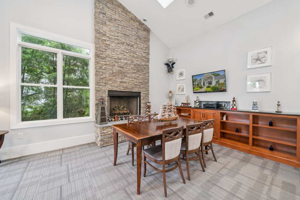 Dining area with fireplace at Pilot House in Newport News, Virginia
