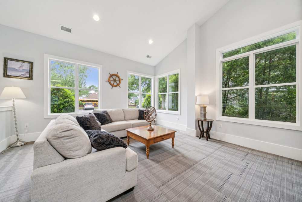 Clubhouse with lounge seating and large window at Pilot House in Newport News, Virginia