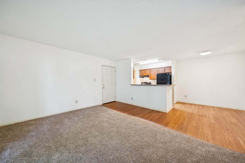 Unfurnished living room with view to kitchen and dining area at Pilot House in Newport News, Virginia