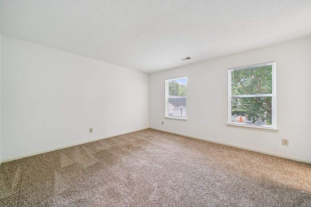 Unfurnished living room with carpet flooring at Pilot House in Newport News, Virginia