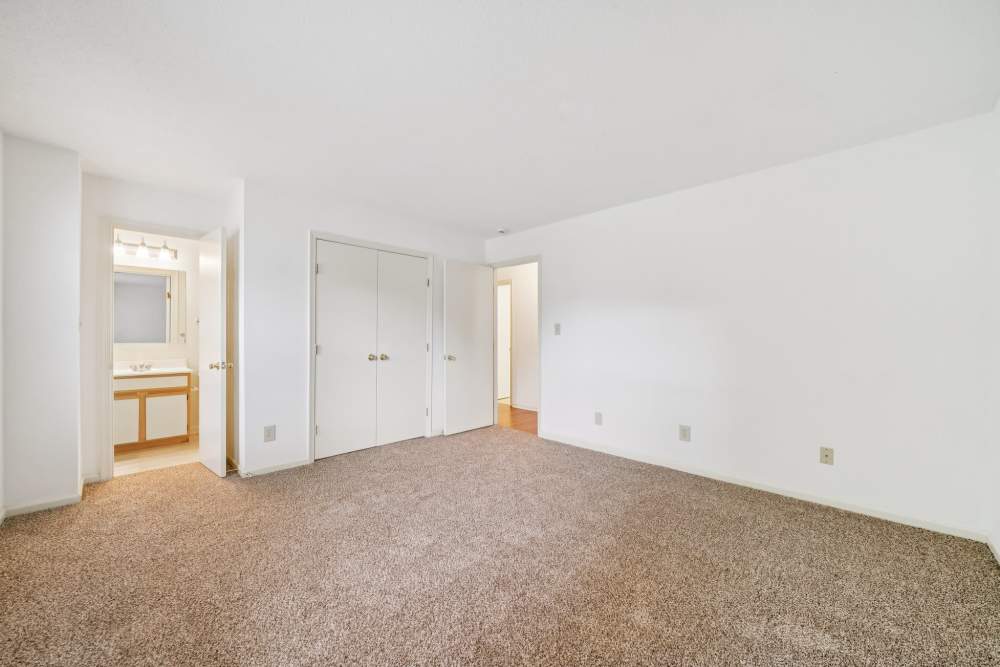 Bedroom with attached bathroom and closet at Pilot House in Newport News, Virginia