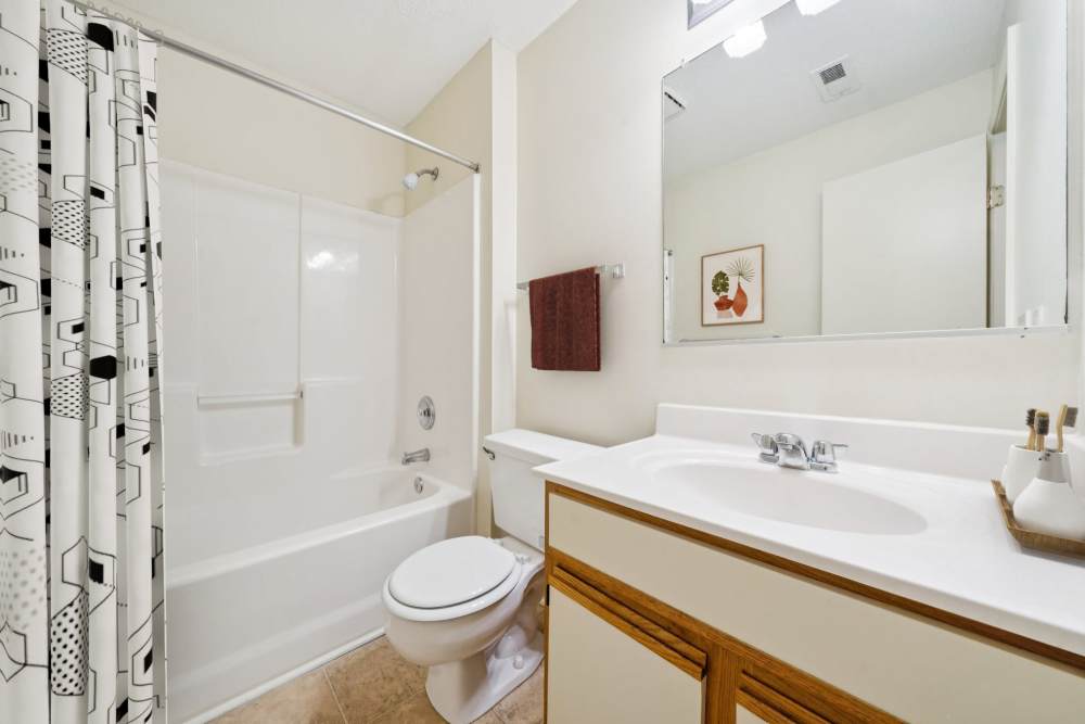 Bathroom with bathtub and curtain at Pilot House in Newport News, Virginia