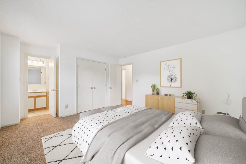 Bedroom with cozy bed and attached bathroom at Pilot House in Newport News, Virginia