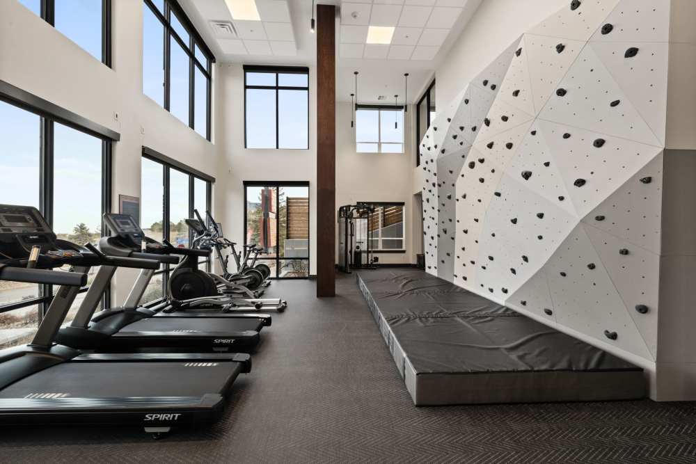 A fitness center featuring a climbing wall at The Lock at Flatirons in Broomfield, Colorado