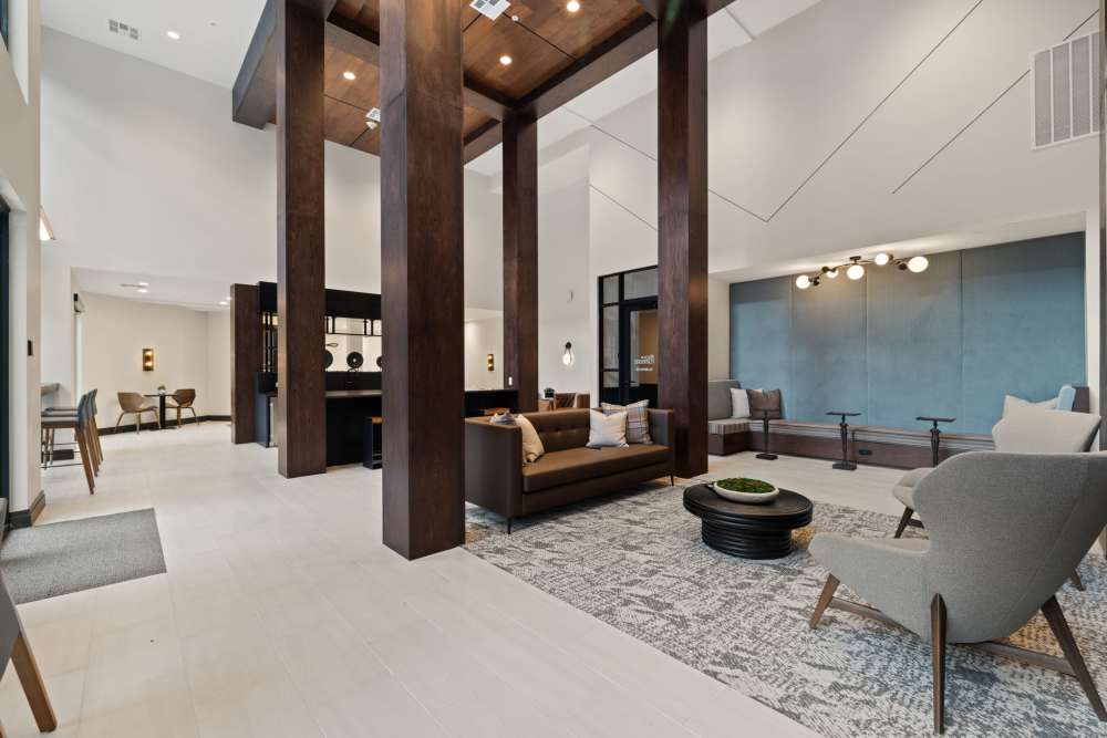 Cozy clubhouse interior featuring stylish lounge seating at The Lock at Flatirons in Broomfield, Colorado