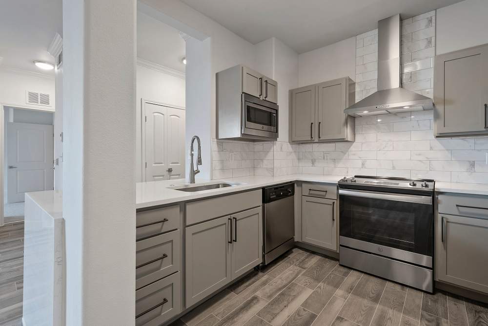 Kitchen with stainless-steel appliances at Trinity Bluff & Trinity District in Fort Worth, Texas