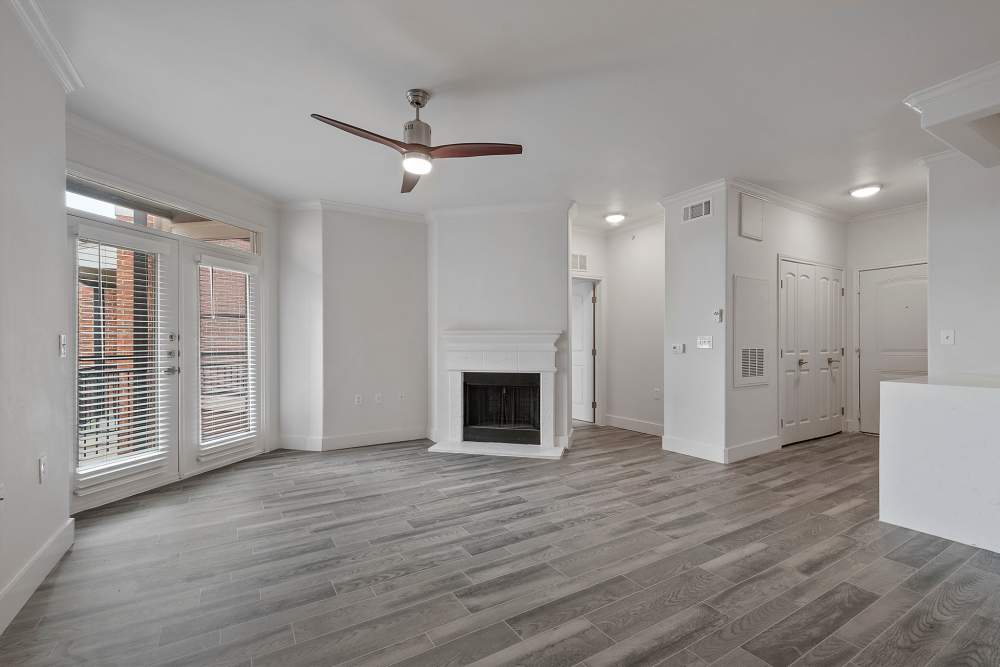Living room with fireplace at Trinity Bluff & Trinity District in Fort Worth, Texas