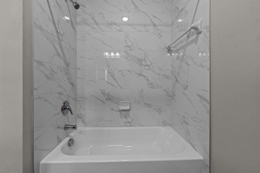 Bathtub at Pebble Brook Apartments in Jacksonville,Texas
