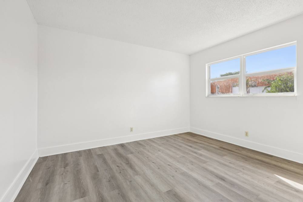 Unfurnished apartment bedroom at El Jardin Apartments in Hollywood, Florida