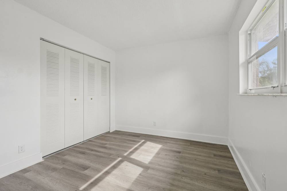 Spacious closets in apartment bedroom at El Jardin Apartments in Hollywood, Florida