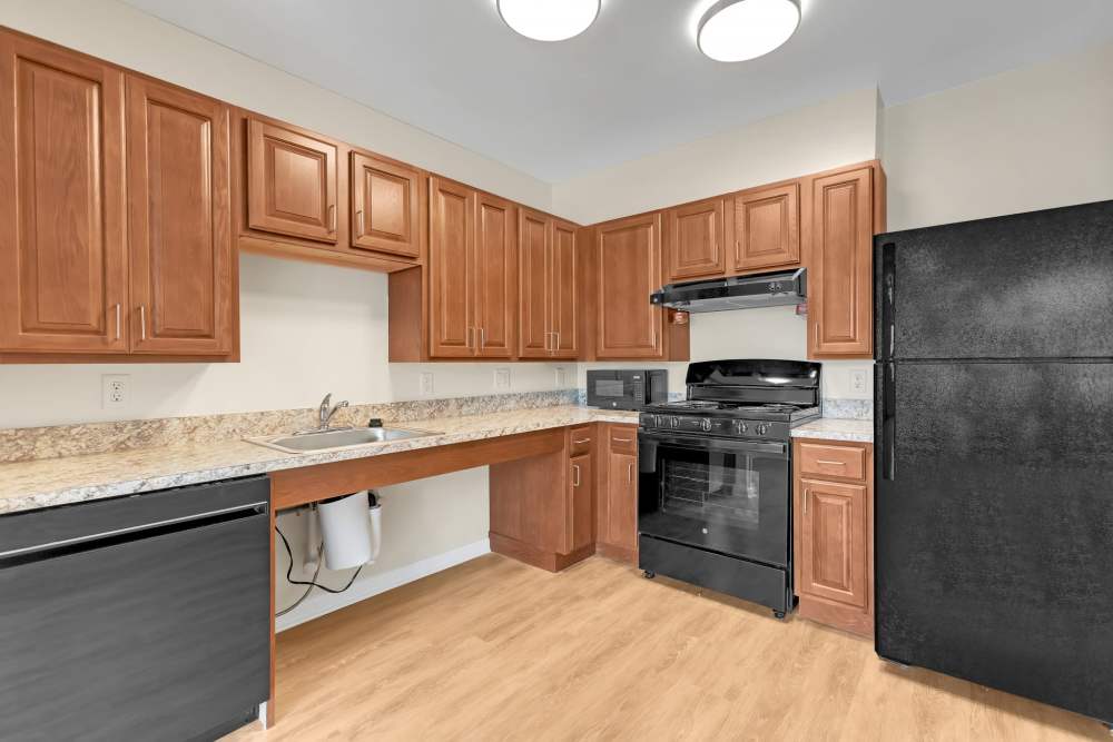 Kitchen with wood cabinets at Robinson Overlook in Columbia, Maryland