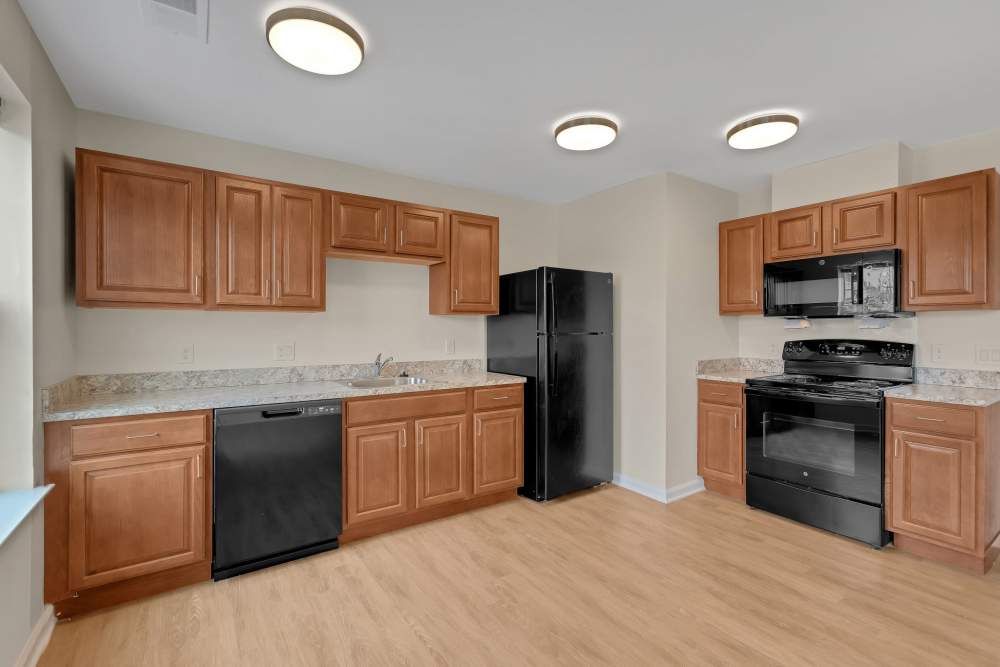 Kitchen with black appliances at Robinson Overlook in Columbia, Maryland
