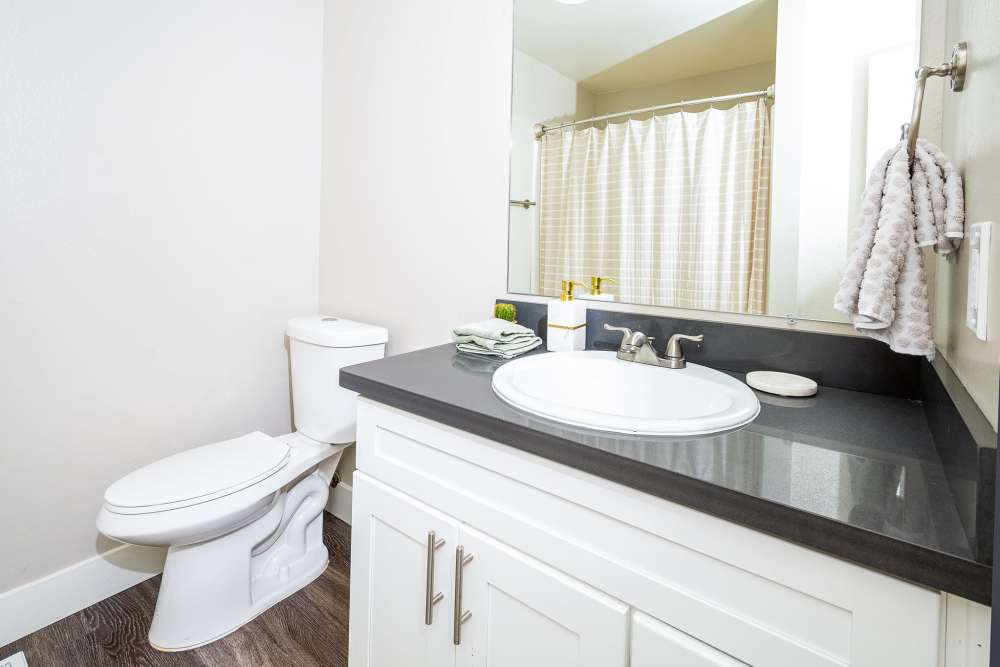 Bathroom with large mirror at  The Marq in Santa Rosa, California