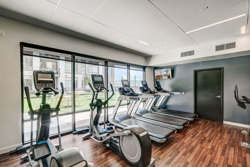 Fitness center with treadmills and ellipticals at Vue West Apartment Homes in Denver, Colorado