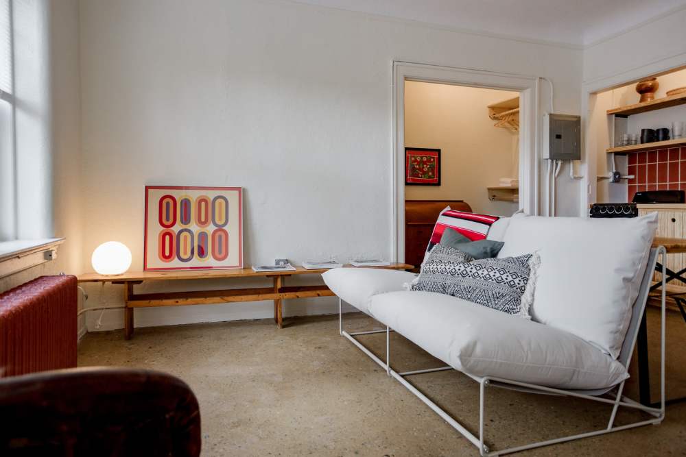 Model living room with hardwood floors at Detroit Living in Detroit, 