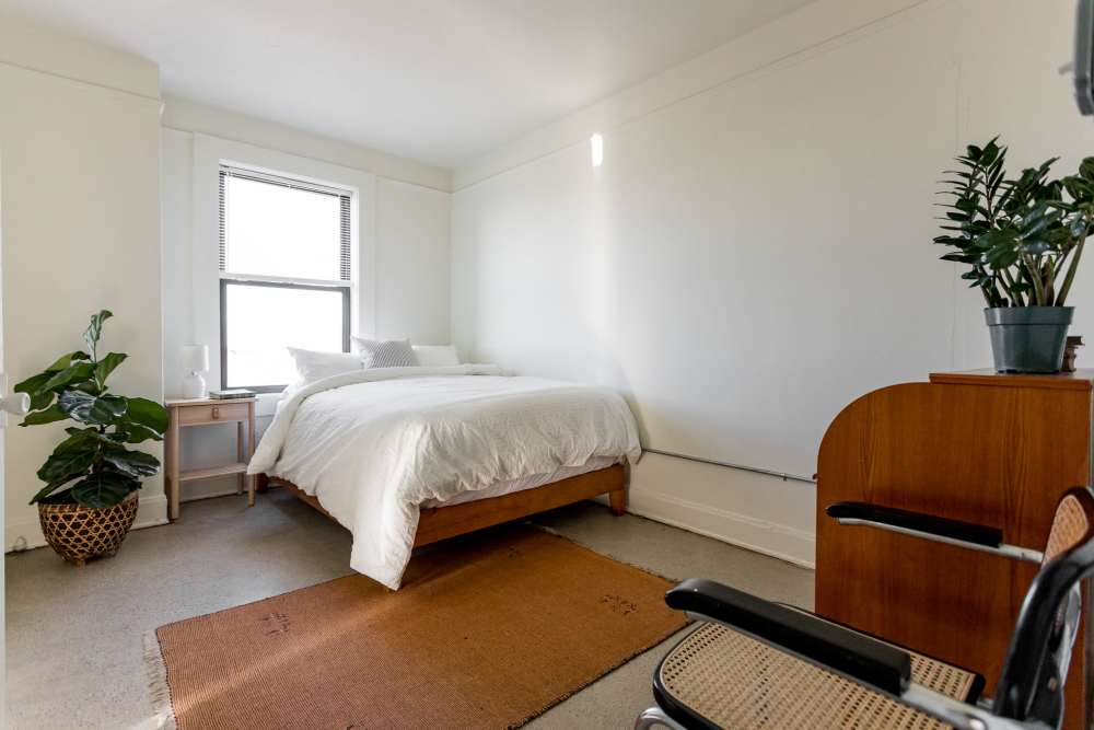 Bedroom with window at Detroit Living in Detroit, Michigan