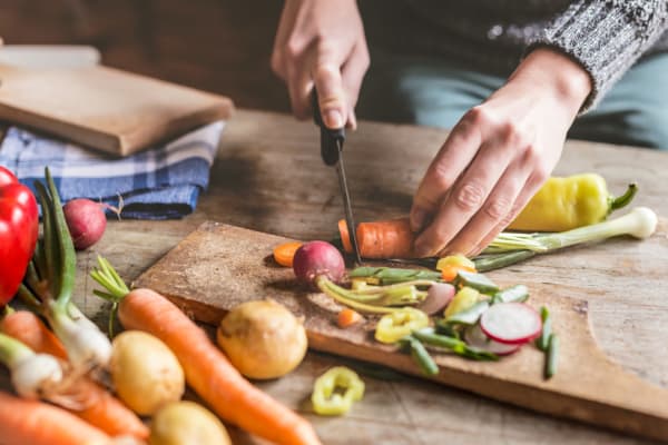 Resident chopping fresh veggies from the market near Westover Pointe in Wilmington, Delaware