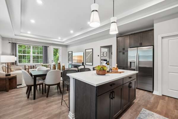 Beautiful apartment kitchen with stainless-steel appliances and trendy cabinetry at Encore at West Valley in White Lake,Michigan