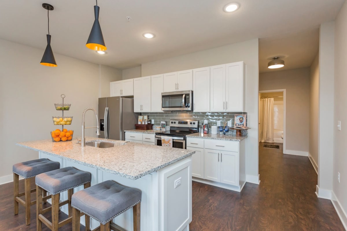 Kitchen with a breakfast bar at Rivertop Apartments in Nashville, Tennessee