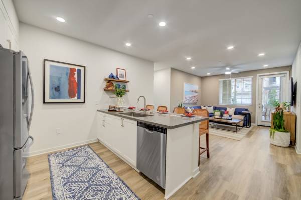 Kitchen with Bar and Dining Area at Aviara at Mountain House in Mountain House, California