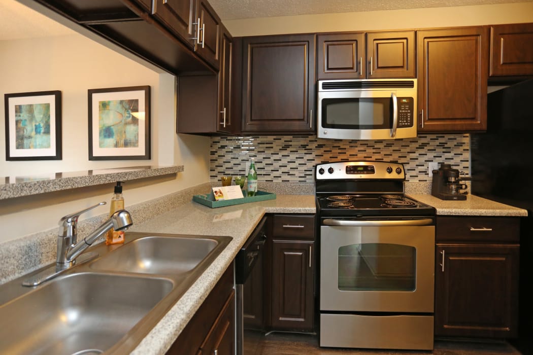 Kitchen of model home at Village Green of Bear Creek in Euless, Texas