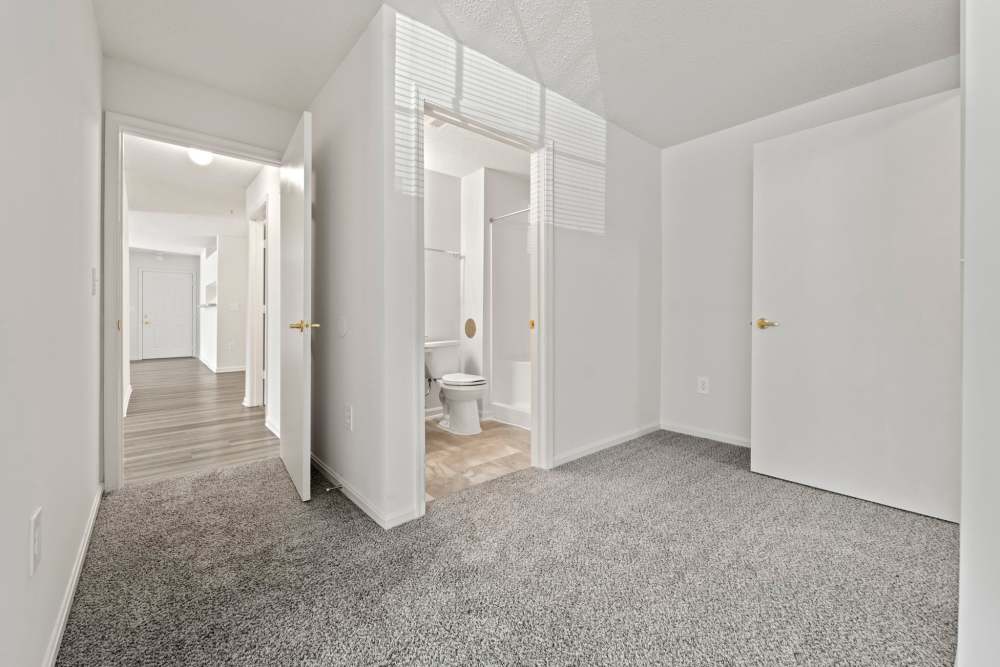 Bedroom connecting to multiple rooms and bathroom at Dulles Center Apartments in Herndon, Virginia
