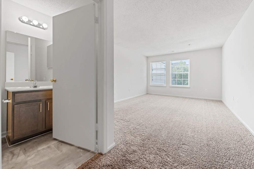 Bedroom with connecting bathroom at Dulles Center Apartments in Herndon, Virginia