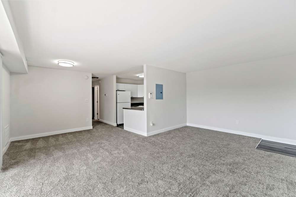 Apartment living area attached to the modern kitchen at Chesapeake Landing Apartments in Landover Hills, Maryland