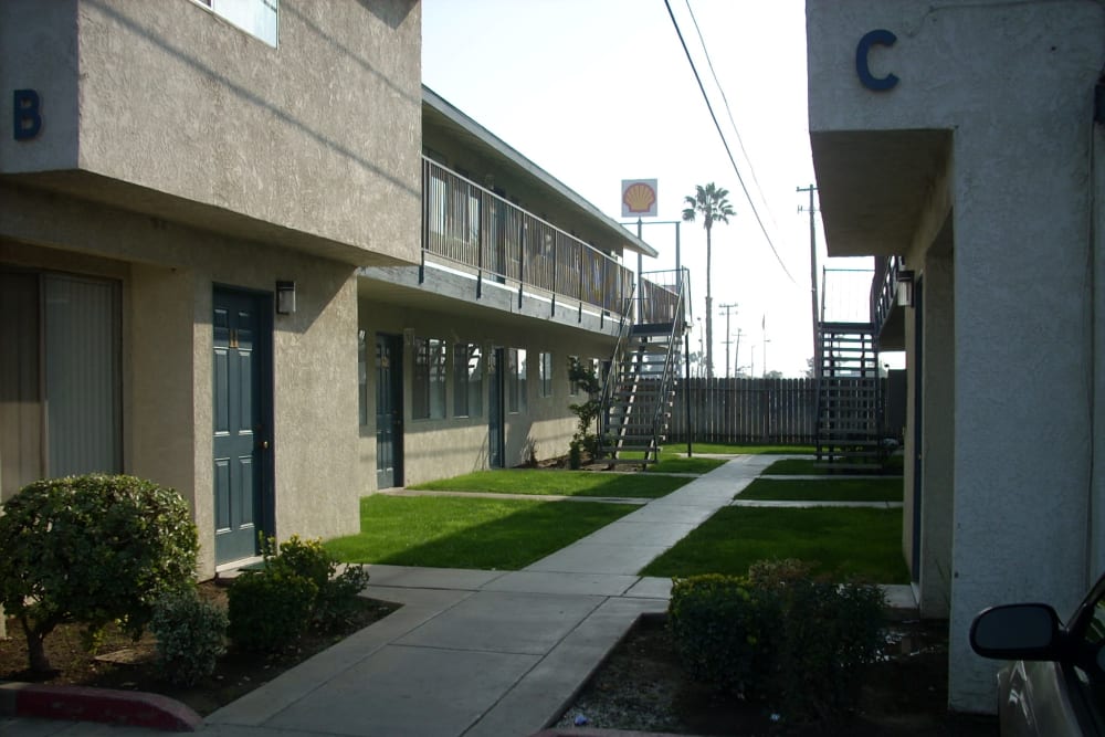 Outdoor walkways at El Potrero Apartments in Bakersfield, California