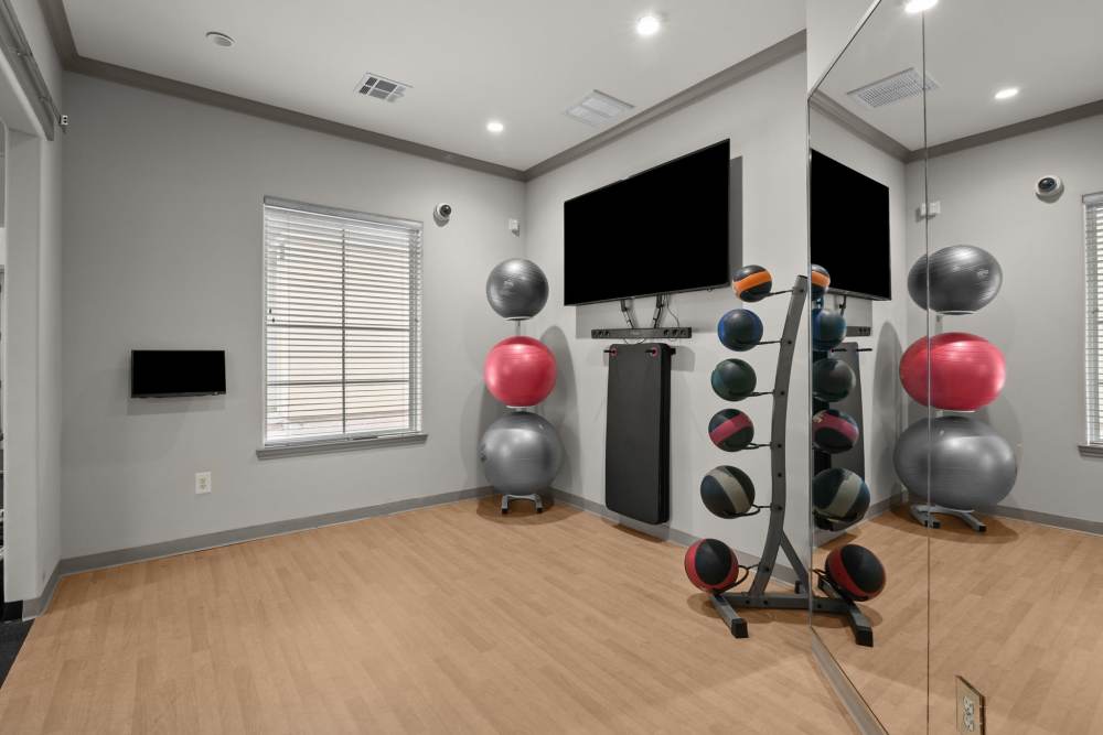 Fitness center with excercise ball at The Loop in Conroe, Texas