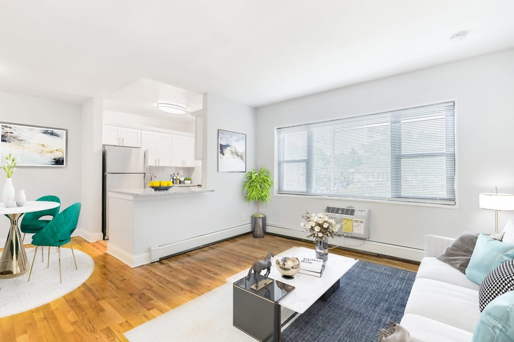 Living room with large windows at Eagle Rock Apartments at Hicksville/Jericho in Hicksville, New York