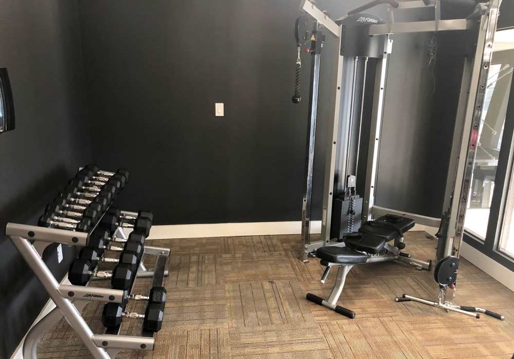 Fitness center at Branch Creek Apartments in Carrollton, Texas