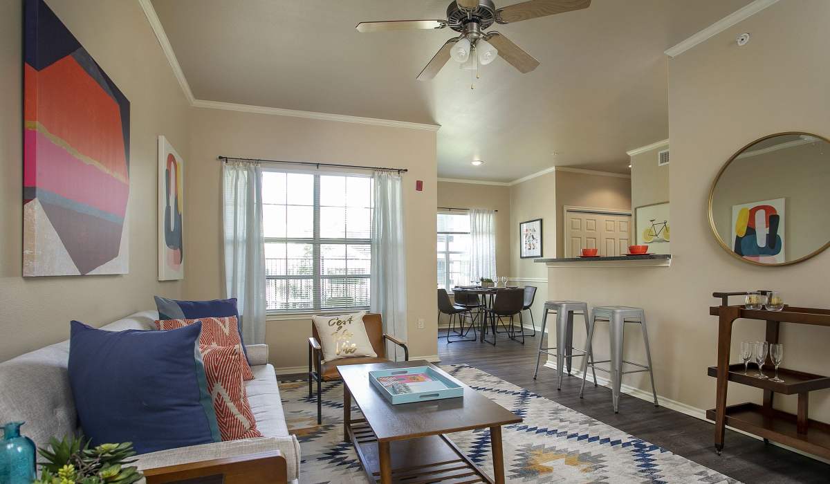 View of living room with access to kitchen at Summerwood, Tyler, Texas