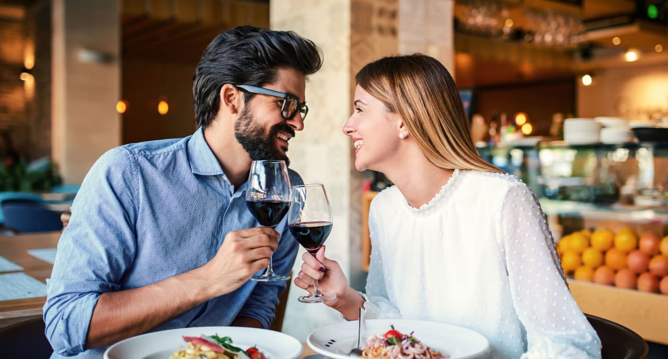 Couple out enjoying a delicious meal and wine in Caldwell, New Jersey near Parkway East Apartments