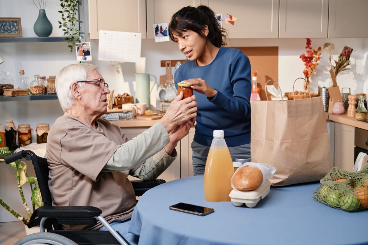 Caregiver assisting resident at Trustwell Living in New York, New York