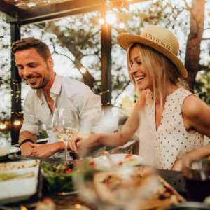 Elegant outdoor dining with delicious food and warm ambience at Pomona Apartments in Ocala, Florida