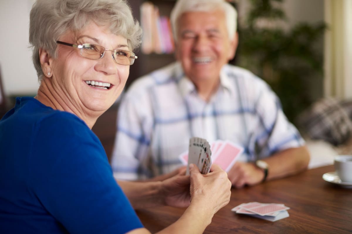 Resident couple playing a game at Canoe Brook Assisted Living in Broken Arrow, Oklahoma