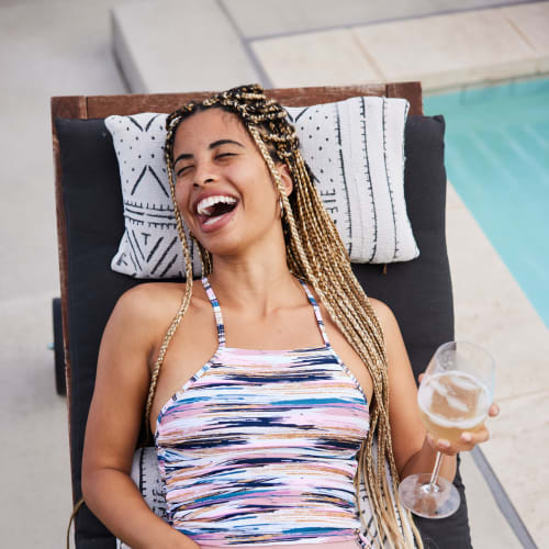 Resident relaxing by sparkling pool at Solaire 10914 Georgia in Silver Spring, Maryland