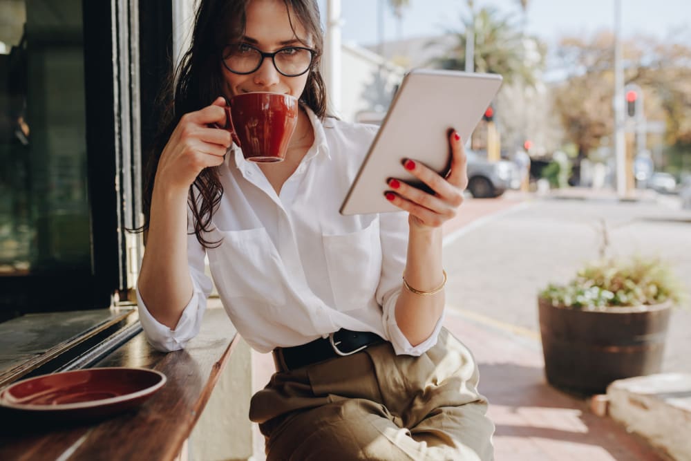 Woman enjoying some coffee at Regency Johns Creek Walk in Johns Creek, Georgia