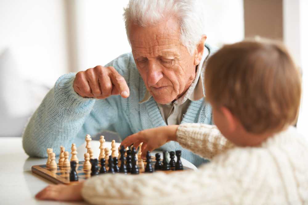 Resident playing chess at Elan Manatee in Bradenton, Florida