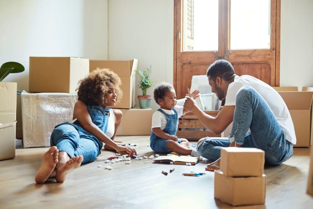 A family in El Cajon unpacks after a move.