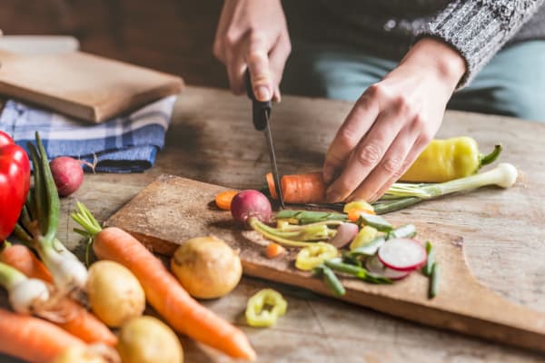 Resident cooking dinner at Parc at Lyndhurst in Lyndhurst, New Jersey